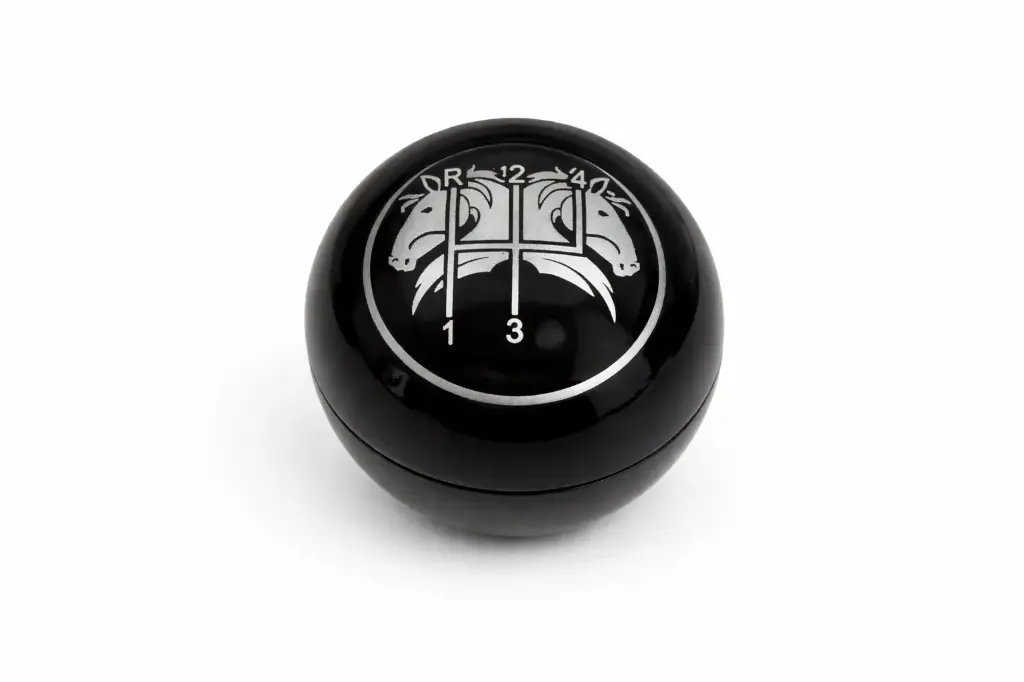 Pommeau noir cerclage chromé avec schéma de passage de vitesse + dessin 2 chevaux